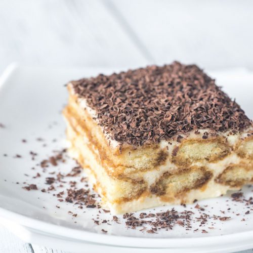 Tiramisu with chocolate topping on the white plate